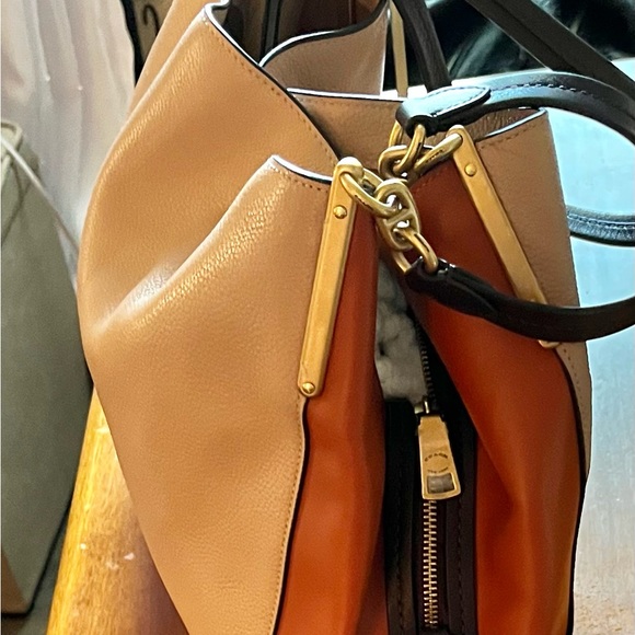 Barely used Tri~Color Coach Purse lots of pockets and zippers!